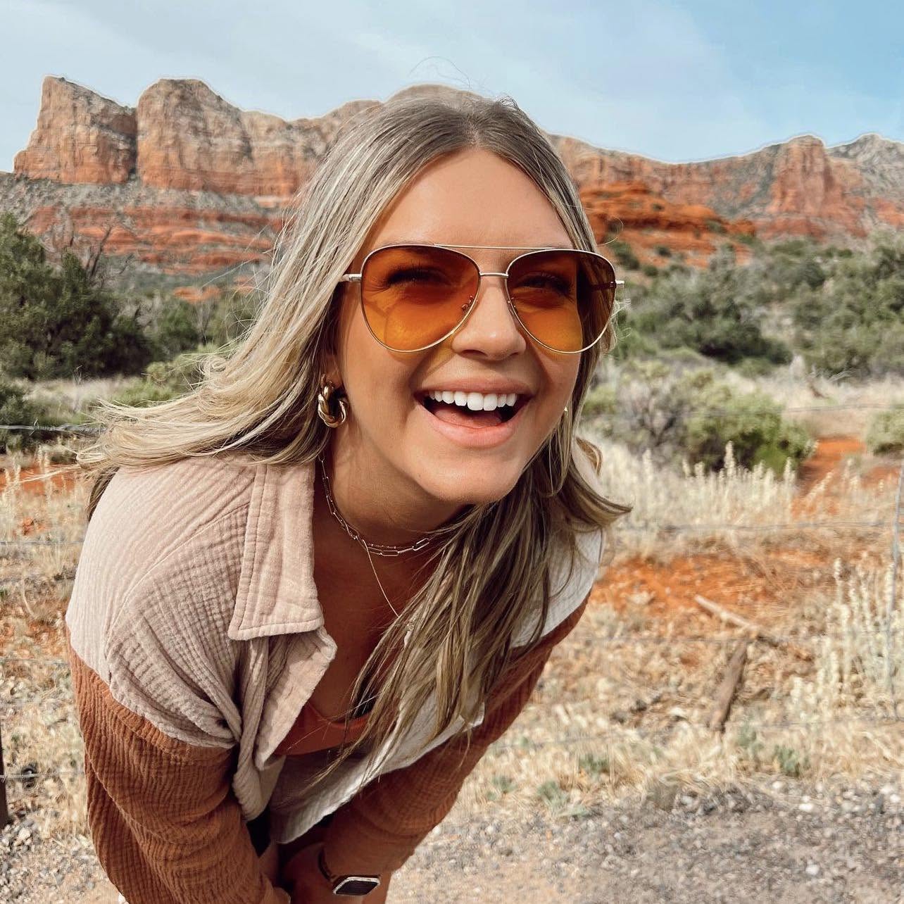 Kristin laughing outdoors