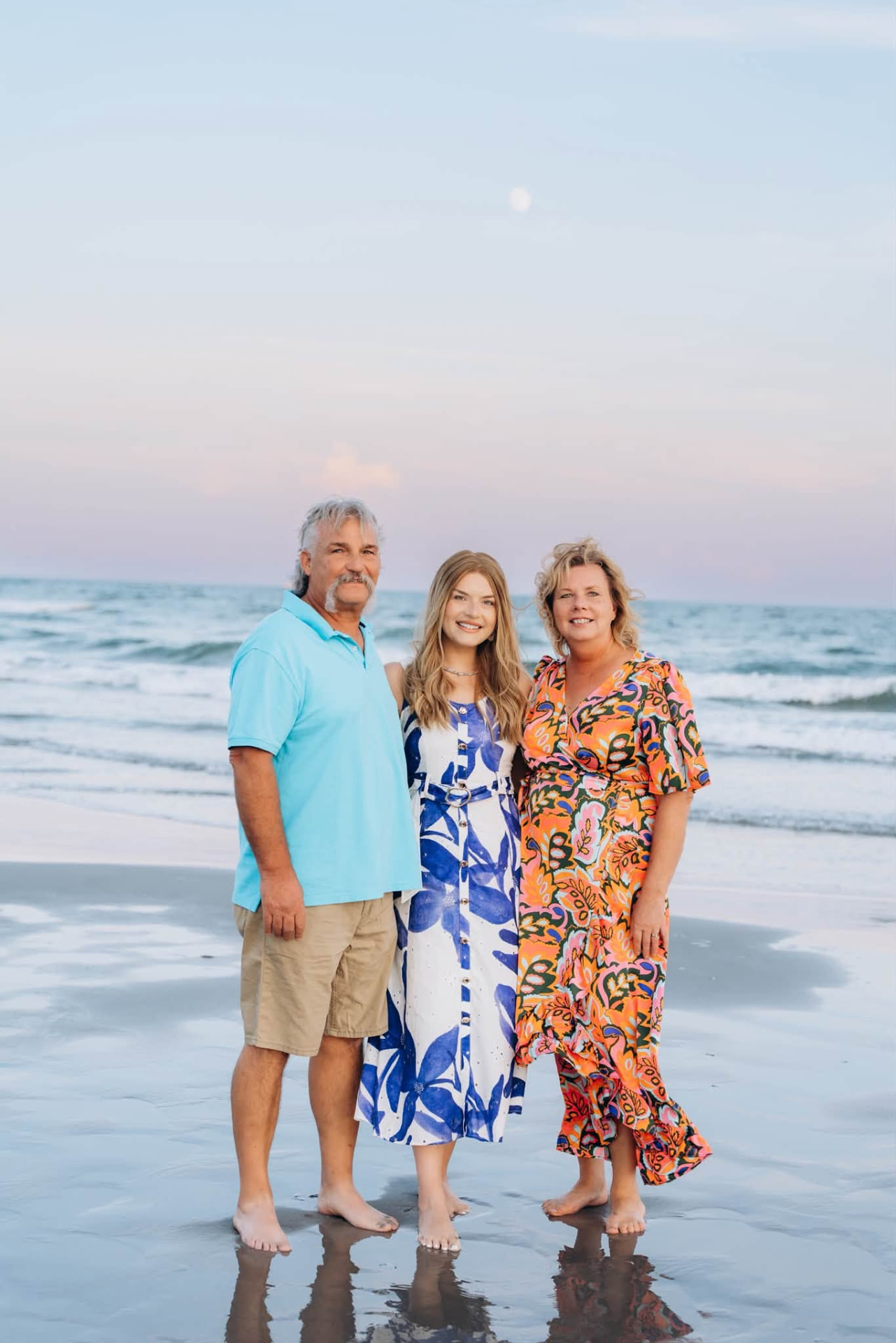 Kristin with her parents at the water's edge